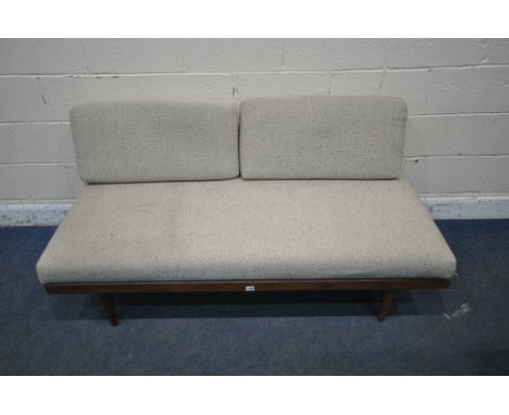 IN THE MANNER OF INGMAR RELLING FOR EKORNES, A NORWEGIAN MID CENTURY TEAK DAYBED, with beige upholstery and a sprung seat, ra