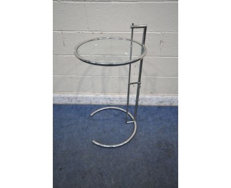 POSSIBLY EILEEN GRAY, A MID CENTURY TUBULAR CHROME TELESCOPIC SIDE TABLE, with various height settings and a glass insert, di