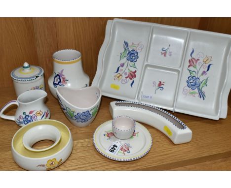 EIGHT PIECES OF POOLE POTTERY, all with floral decoration, including an hors oeuvres dish, an eggcup on integral stand, a pre