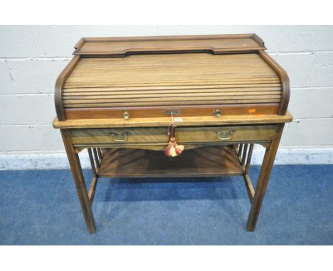 ANGUS OF LONDON, AN EARLY 20TH CENTURY WALNUT ROLL TOP DESK, with a raised shelf, the tambour door enclosing a fitted interio