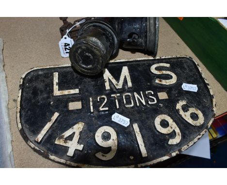 A LMS WAGON PLATE AND A BICYCLE LAMP, comprising a London, Midland and Scottish Railway cast iron wagon plate, the raised let