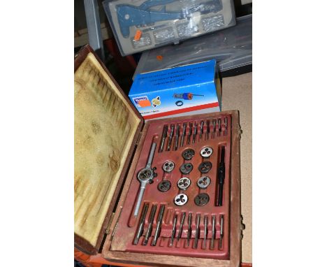 A GROUP OF CASED OR BOXED TOOLS, to include a tap and die set in a wooden case (one piece missing), a cased GS Workzone hand 