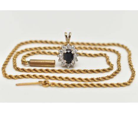 A 9CT GOLD CLUSTER PENDANT AND A YELLOW METAL CHAIN, oval cluster set with a central oval cut deep blue sapphire, in a surrou