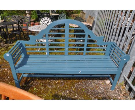 A MODERN WOODEN SLATTED LUTYENS GARDEN BENCH with scrolled ends and shaped back width 180cm