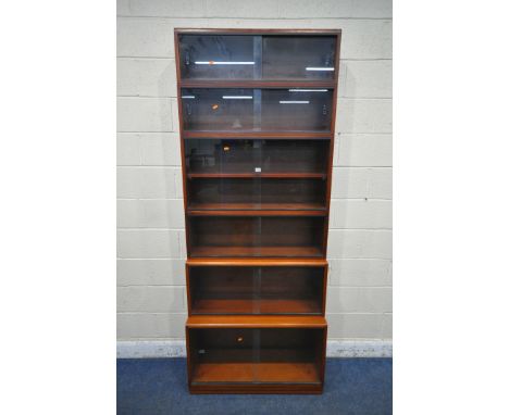 A 20TH CENTURY SIMPLEX SIX SECTION MAHOGANY STACKING BOOKCASE, all sections with double sliding glass doors, one section with