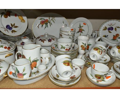 A LARGE QUANTITY OF ROYAL WORCESTER 'EVESHAM' PATTERN DINNERWARE, comprising three covered tureens, flan dish, seven soup dis