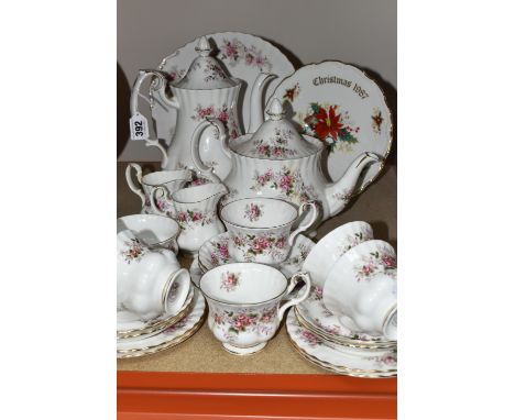 A ROYAL ALBERT 'LAVENDER ROSE' PATTERN TEA SET, comprising a coffee pot, teapot, cake plate, two milk jugs, sugar bowl, six c