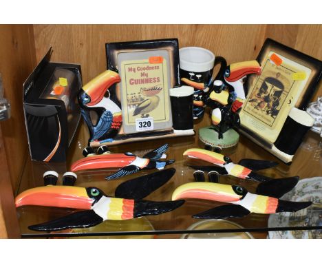 A GROUP OF MODERN GUINNESS COLLECTABLES, comprising two Enesco picture frames, a small standing toucan figure height 11.5cm (