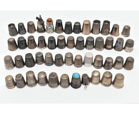 A BAG OF WHITE METAL THIMBLES, various designs and patterns, some set with semi-precious stone terminals, paste and enamel de