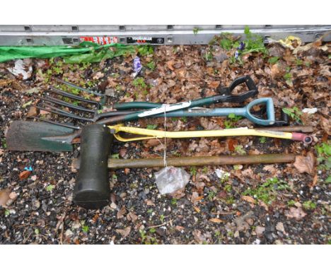 A SELECTION OF GARDEN TOOLS including a marquee mallet, forks, spades etc