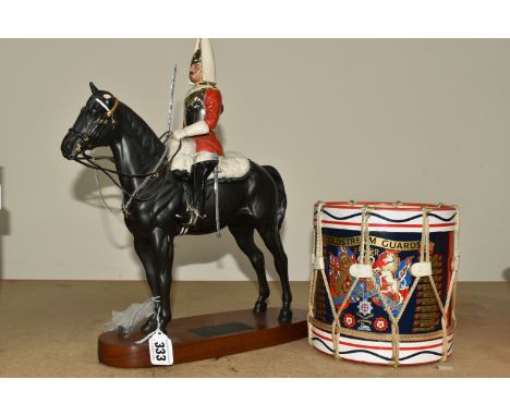 A BESWICK LIFE GUARD FROM THE CONNOISSEUR HORSES SERIES, model no. 2562, style 2, with sword, mounted on a titled wooden plin