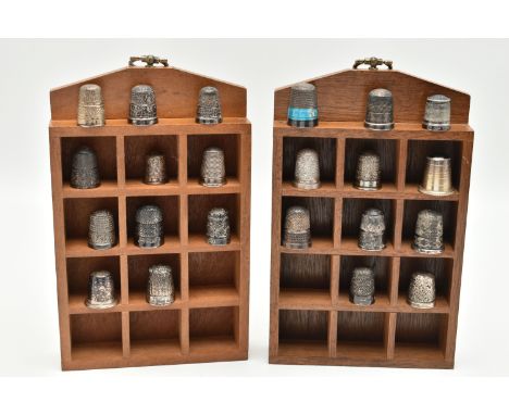 A SELECTION OF SILVER THIMBLES AND TWO DISPLAY UNITS, to include twenty-two thimbles, various designs and patterns, one set w