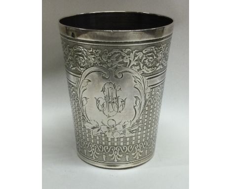 An engine turned French silver beaker. Approx. 108 grams. Est. £120 - £150.