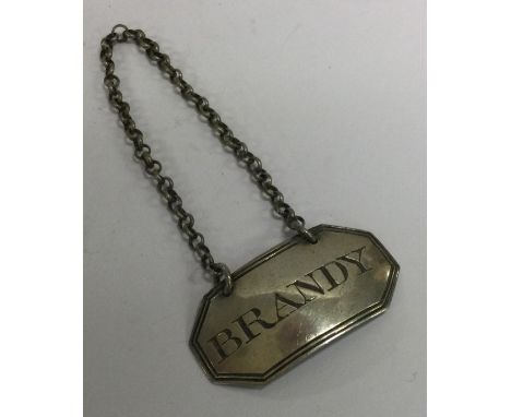 A Georgian silver wine label for 'Brandy'. 1829. Approx. 5 grams. Est. £30 - £50.