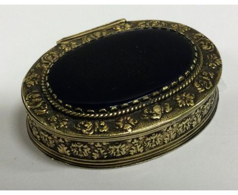 An early 18th Century silver and gem stone snuff box with embossed decoration. Circa 1730. Approx. 70 grams. Est. £500 - £800