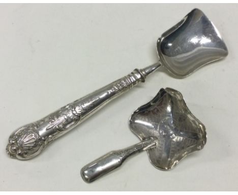 A long handled Queen's pattern silver caddy spoon together with another example. Approx. 28 grams. Est. £30 - £40.