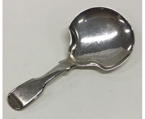 A silver caddy spoon with fiddle pattern and large shaped bowl. London 1832. By CB. Approx. 13 grams. Est. £20 - £30.