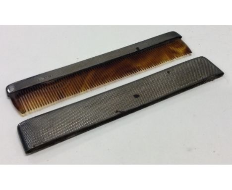 CHESTER: A cased silver engine turned comb. Approx. 34 grams. Est. £30 - £50.