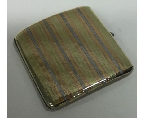 A Continental silver mixed metal and gem stone cigarette case with gold inlay. Approx. 100 grams. Est. £100 - £120.