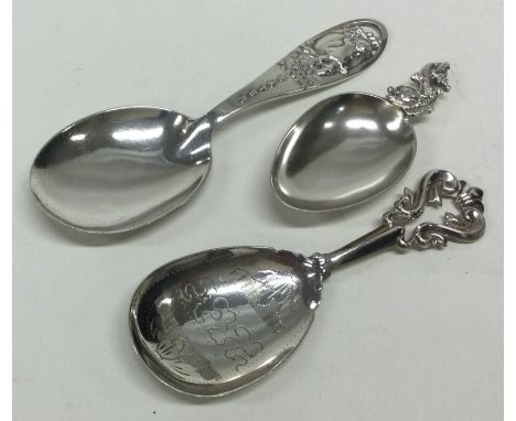 Three silver caddy spoons. Various dates and makers. Approx. 32 grams. Est. £30 - £40.