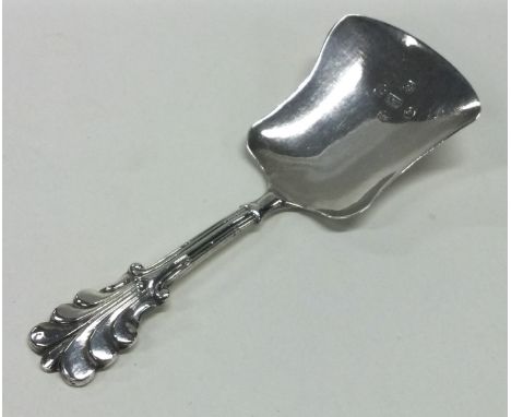 A silver caddy spoon with Fleur de Lys handle. Birmingham 1843. By FC. Approx. 7 grams. Est. £30 - £40.