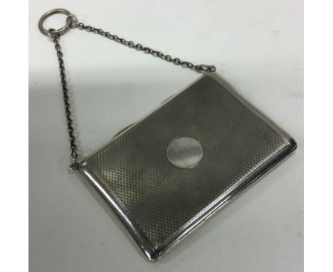 An engine turned silver hinged card case with suspension chain. By Sampson Mordan & Co. London 1929. Approx. 77 grams. Est. £