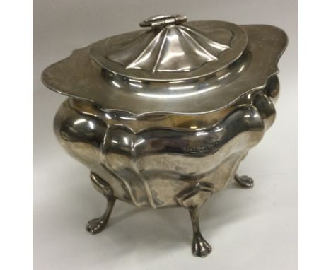 A heavy silver tea caddy with lift-off cover. Sheffield 1920. By Walker & Hall. Approx. 388 grams. Est. £300 - £500.