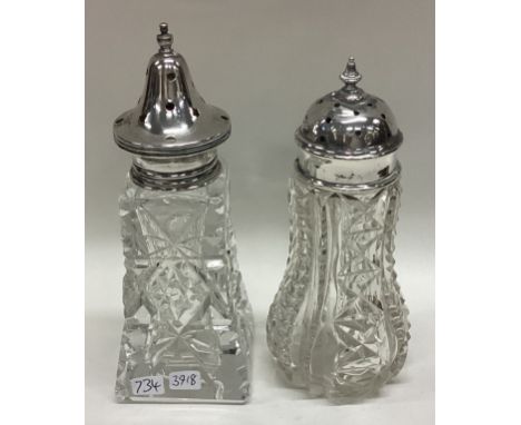 Two glass mounted silver sugar casters. Est. £20 - £30.