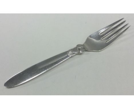 GEORG JENSEN: A stylish silver fork of typical form. Approx. 46 grams. Est. £30 - £40.