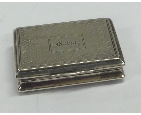 A Victorian silver vinaigrette with engine turned decoration and unusual pierced grill. Birmingham 1843. By Yapp & Woodward. 