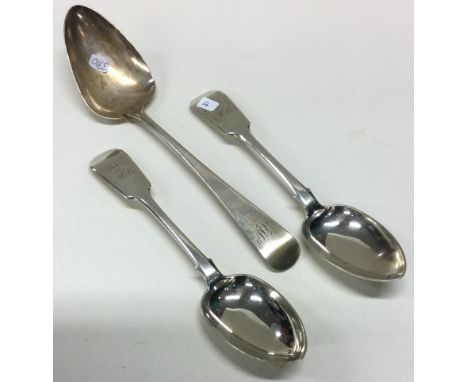 EXETER: A pair of silver fiddle pattern dessert spoons together with a table spoon. Approx. 155 grams. Est. £30 - £40.