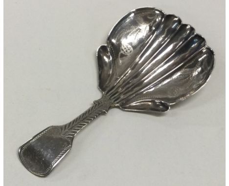 A silver caddy spoon with engraved fiddle pattern handle and flared bowl. Birmingham 1830. By James Collins. Approx. 5 grams.