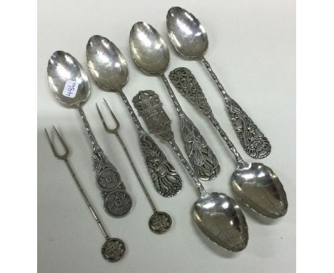 A group of six Chinese silver teaspoons together with a pair of forks. Approx. 88 grams. Est. £40 - £60.