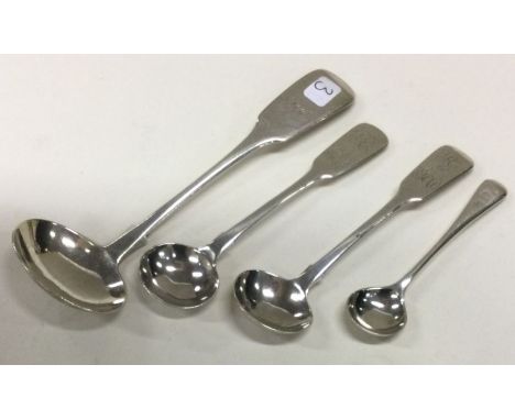EXETER: A fiddle pattern silver cream ladle together with salt spoons etc. Approx. 38 grams. Est. £20 - £30.