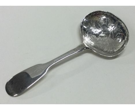A silver caddy spoon with fiddle pattern and engraved bowl. London 1819. By William Bateman. Approx. 12 grams. Est. £30 - £40