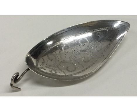 A silver caddy spoon with leaf shaped bowl and coiled handle. London 1799. By Elizabeth Morley. Approx. 7 grams. Est. £50 - £