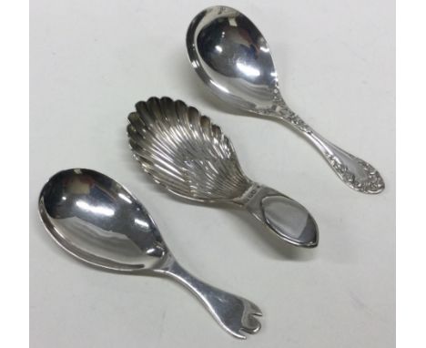 Three 20th Century silver caddy spoons. Various dates and makers. Approx. 37 grams. Est. £30 - £40.
