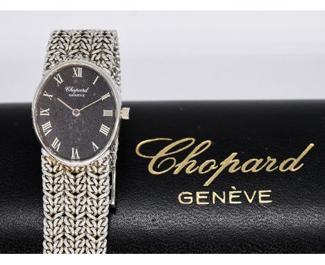   Damenarmbanduhr, bezeichnet Chopard, 80- er Jahre. 750/- Weißgold. Gesamtgewicht ca. 55,2 g. Handaufzug. Hochovales Gehäuse