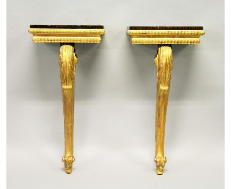 A PAIR OF 19TH CENTURY ROSEWOOD AD GILTWOOD SMALL CONSOLE TABLES, the rectangular tops supported on a leaf and scroll cabriol