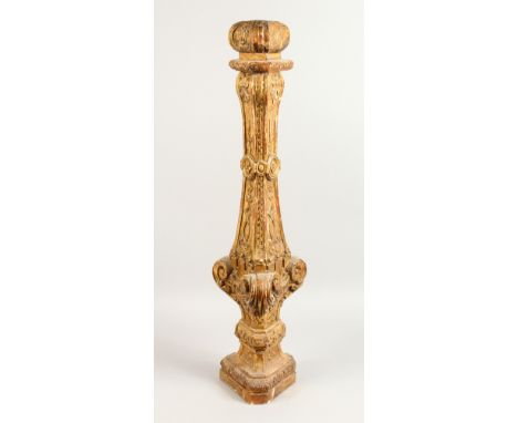 A 19TH CENTURY CARVED GILTWOOD ALTER CANDLESTICK BASE, of triangular outline. 32.5ins high.