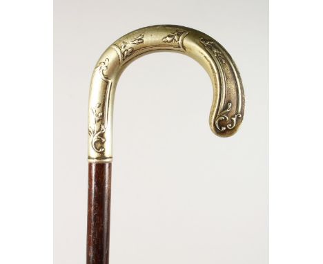 A SILVER HANDLE CROOK WALKING STICK. 2ft 11ins long.