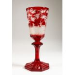 A GOOD LARGE 19TH CENTURY BOHEMIAN RUBY GLASS PEDESTAL GOBLET, engraved with deer in a wooded