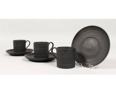 A SET OF THREE WEDGWOOD BLACK BASALT BAMBOO PATTERN COFFEE CANS AND SAUCERS. Impressed WEDGWOOD ETRURIA ENGLAND. (6)