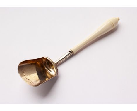 A GEORGE III CADDY SHOVEL, with turned ivory handle. Birmingham 1810.  Maker: Cocks &amp; Bettridge.