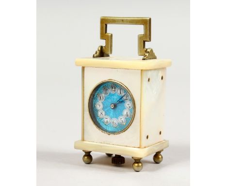 A MINIATURE CARRIAGE CLOCK, with mother-of-pearl case and blue enamel dial. 2.25ins high.