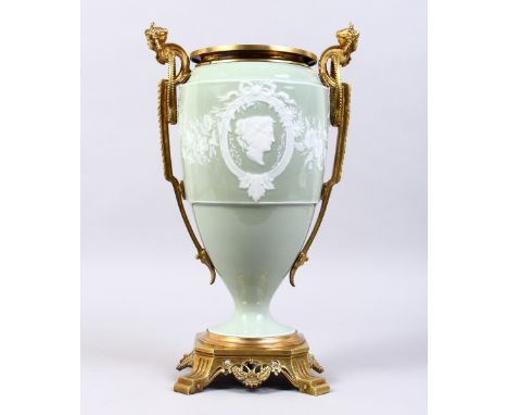 A GOOD 19TH CENTURY FRENCH PATE-SUR-PATE TWO-HANDLED URN, with ormolu mount inset with a portrait. 14ins high.