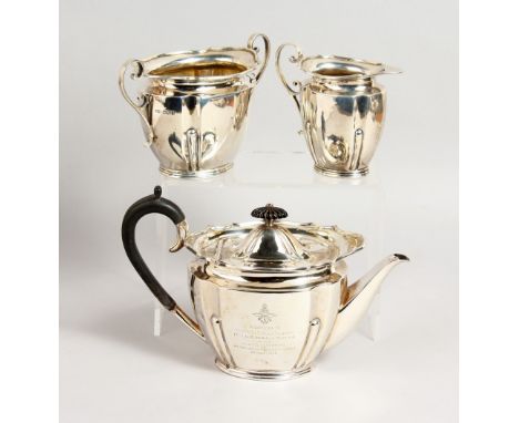 A 1920'S SILVER THREE PIECE TEA SET, including teapot, sugar basin and milk jug. Sheffield 1920.  Maker: R. &amp; B.  Weight 