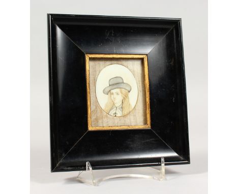 A PORTRAIT MINIATURE OF A YOUNG GIRL IN A HAT, in an ebonised frame. Frame: 7ins x 6.5ins.