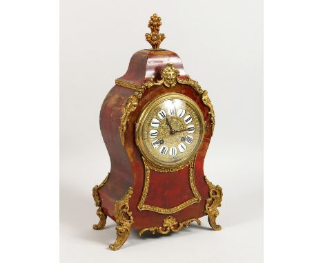 A 19TH CENTURY FRENCH TORTOISESHELL AND ORMOLU MANTLE CLOCK. 14.5ins high.