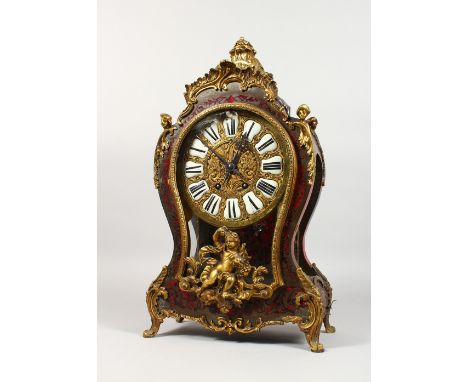 A 19TH CENTURY FRENCH BOULLE BRACKET CLOCK AND BRACKET with scrolls and cupids. Black and white Roman numerals. The movement 